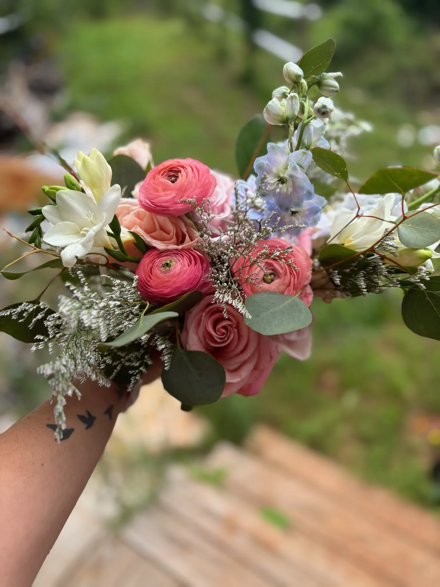 Fresh pink bouquet held by hand — Mother's Day flowers from Heather Florals at the Anniston Farmers Market
